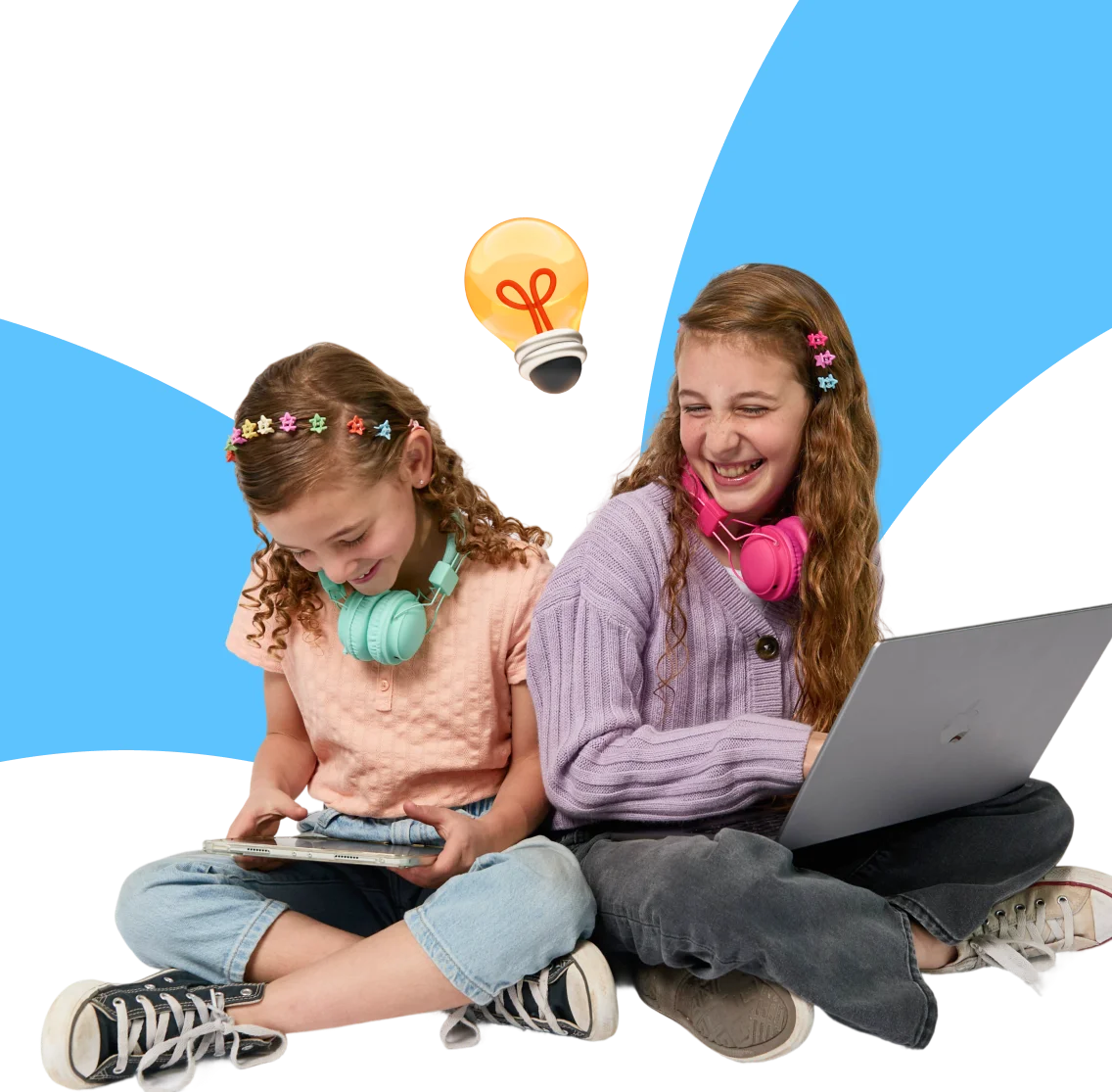 Two smiling girls sit cross-legged with headphones; one uses a tablet, the other a laptop. A lightbulb icon signifies creativity. Black and blue background.