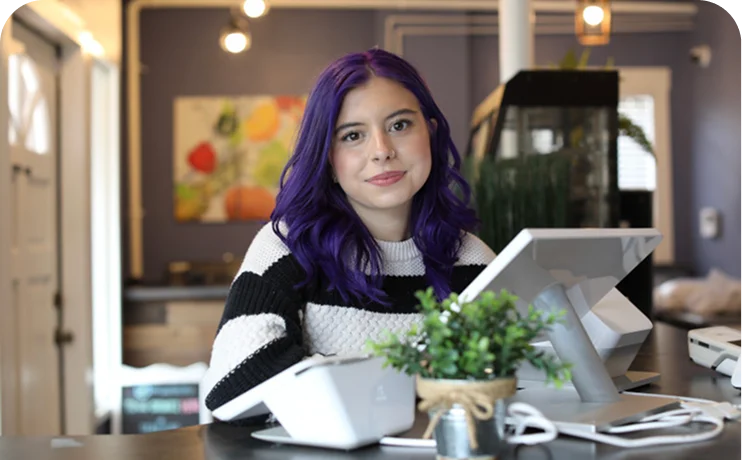Business student gaining customer service and workplace experience in a professional office environment.