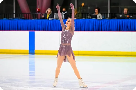 Student athlete performing a figure skating routine, highlighting dedication, talent, and achievement beyond the classroom.