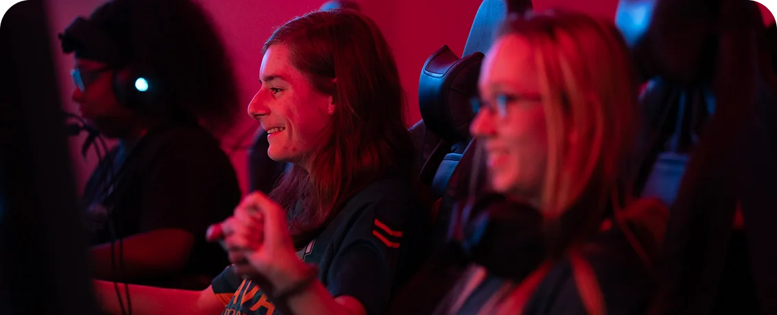 Students participating in a competitive esports event, collaborating and competing in a team-based gaming environment.