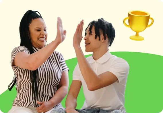Two people share a high five next to a trophy graphic, representing academic achievement, student success, and educational opportunities.