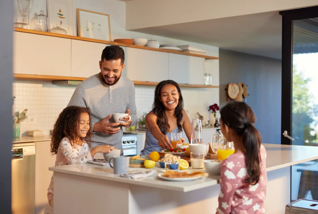 Family sharing a meal before the school day, highlighting the value of morning routines and togetherness.