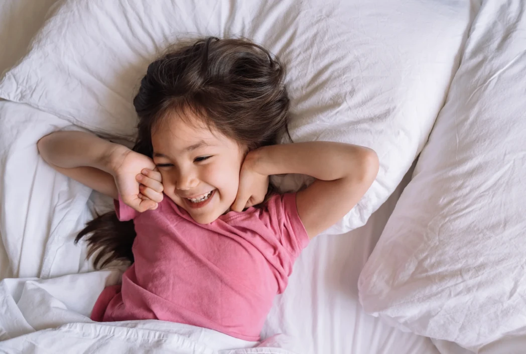 Child starting the day with a healthy morning routine, illustrating the importance of adequate rest before school.