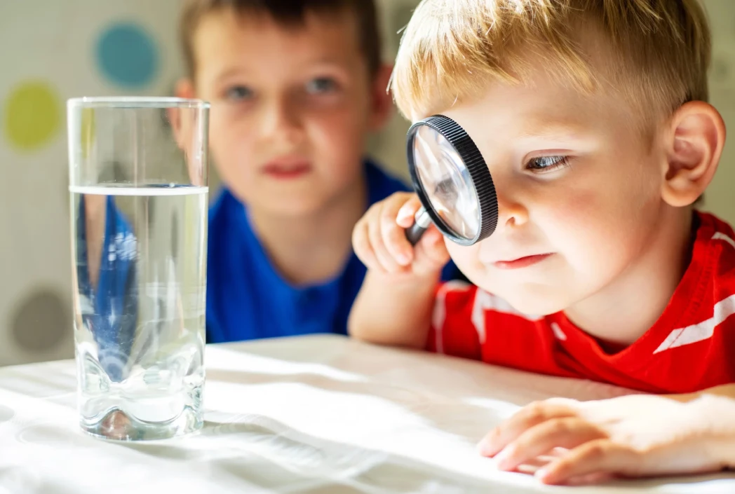 Student exploring scientific concepts through an interactive at-home experiment, building observation and critical thinking skills