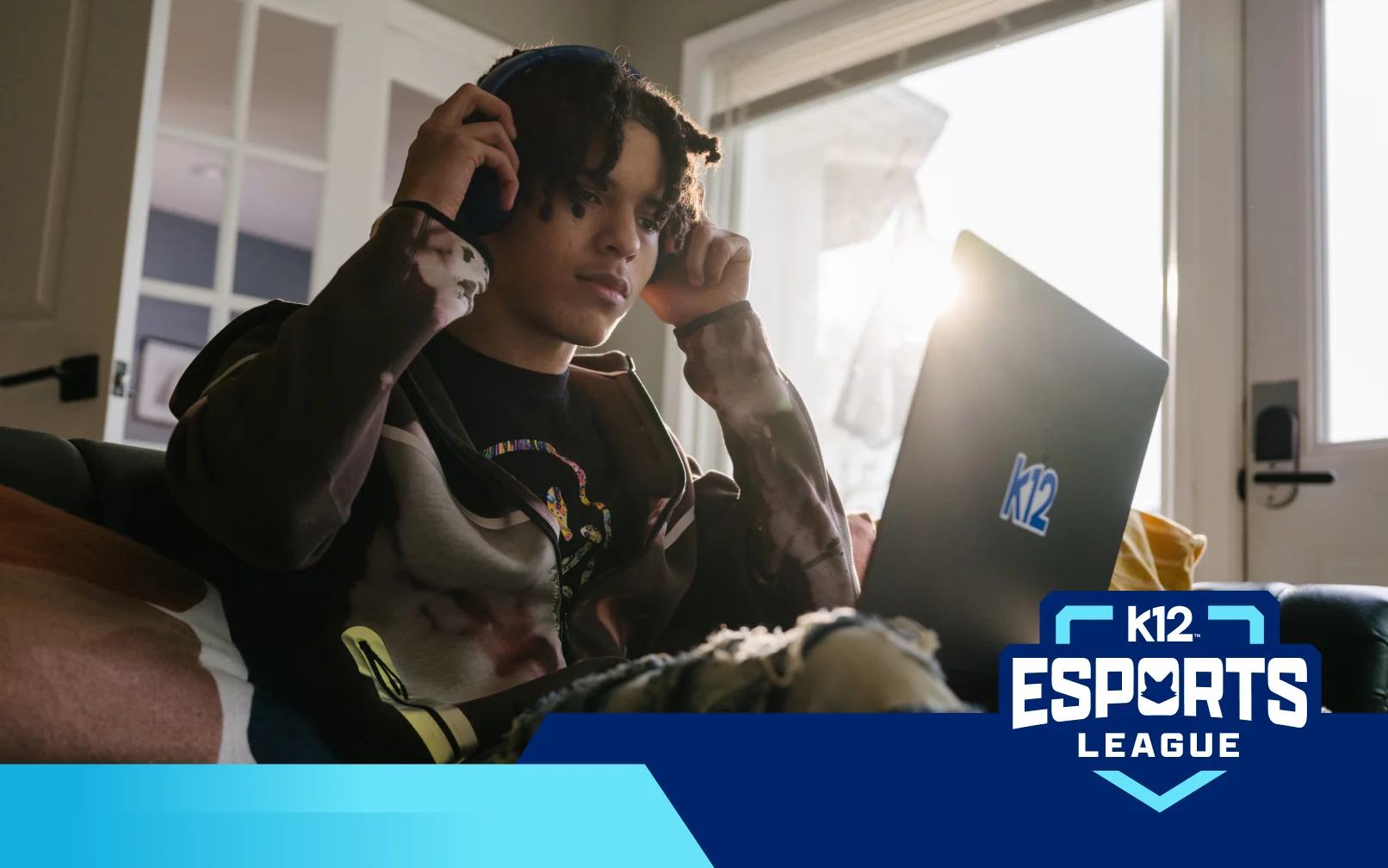 Student competing in the K12 Esports League on a laptop while participating in online gaming and esports programs.